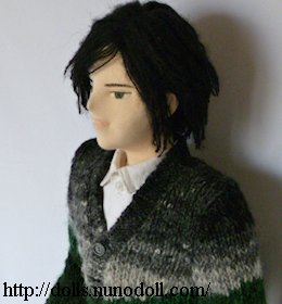 Doll in cardigan