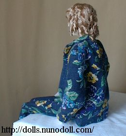 Doll in flowery suit