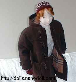 Doll in duffle coat